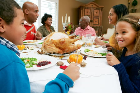 Family around Dinning Room Table-177746084